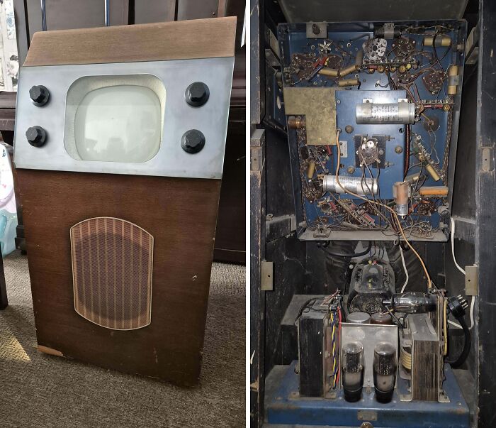 Vintage device showcasing an early television with wooden casing and internal electronic components visible inside.