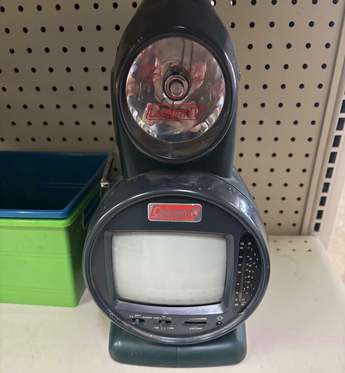 Vintage Coleman electronic device combining a small TV screen and flashlight, illustrating vintage technology devices.