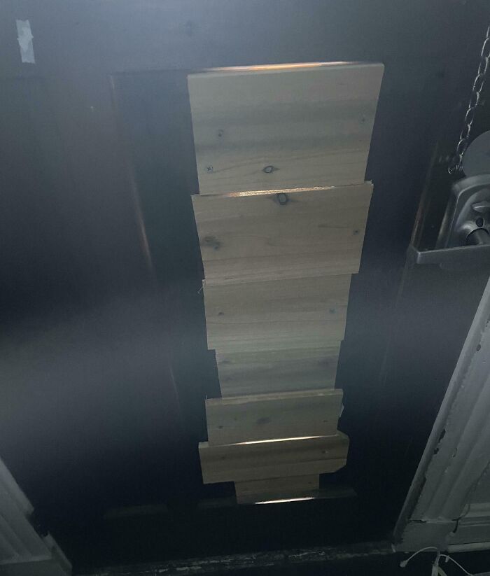 Door blocked with uneven wooden planks showing a landlord special that frustrated renters and caused anger.