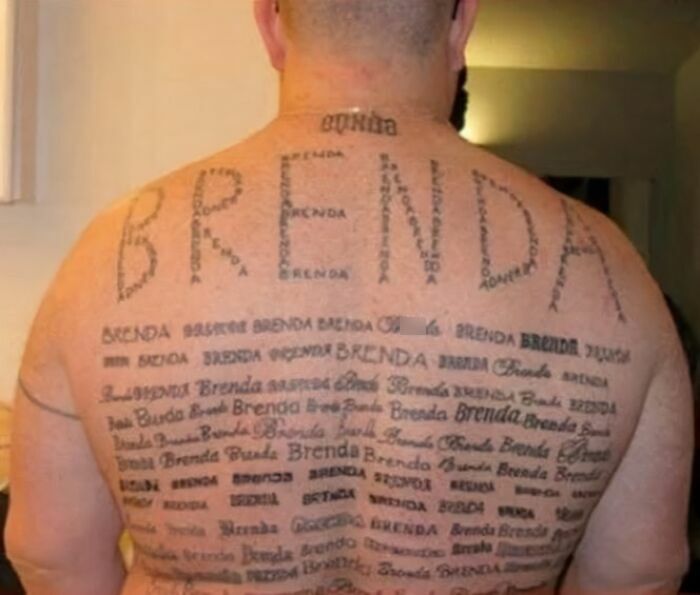 Man with funny and interesting bad tattoo of the name Brenda repeatedly inked across his entire back