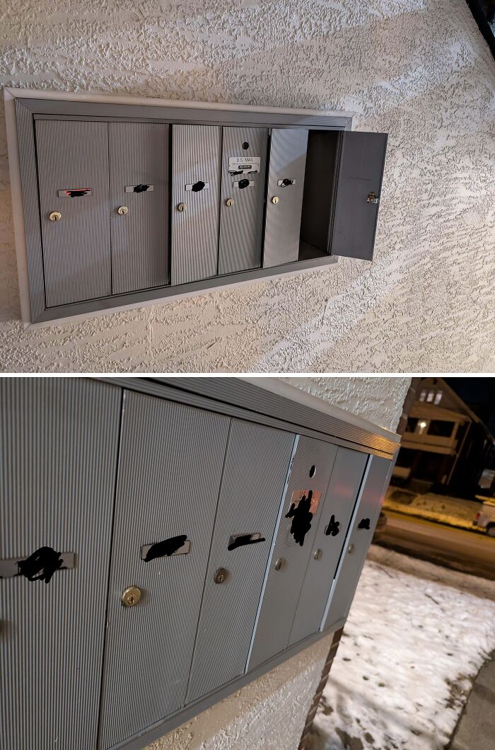 Metal mailboxes outside rental units with one door left open, showing infuriating landlord neglect and poor maintenance.