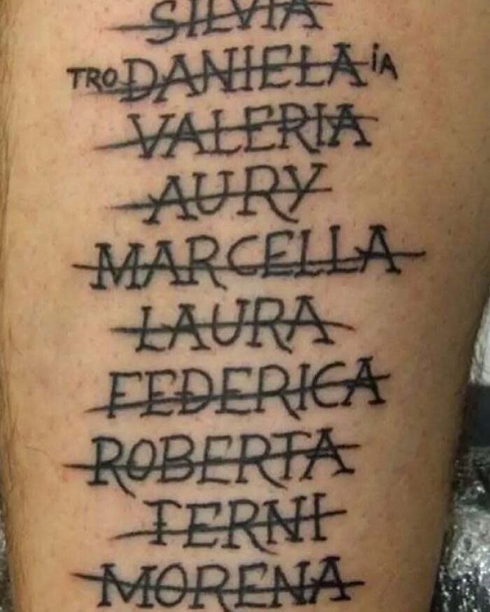 Tattoo of multiple crossed-out female names on skin, showcasing a funny and bad tattoo design.