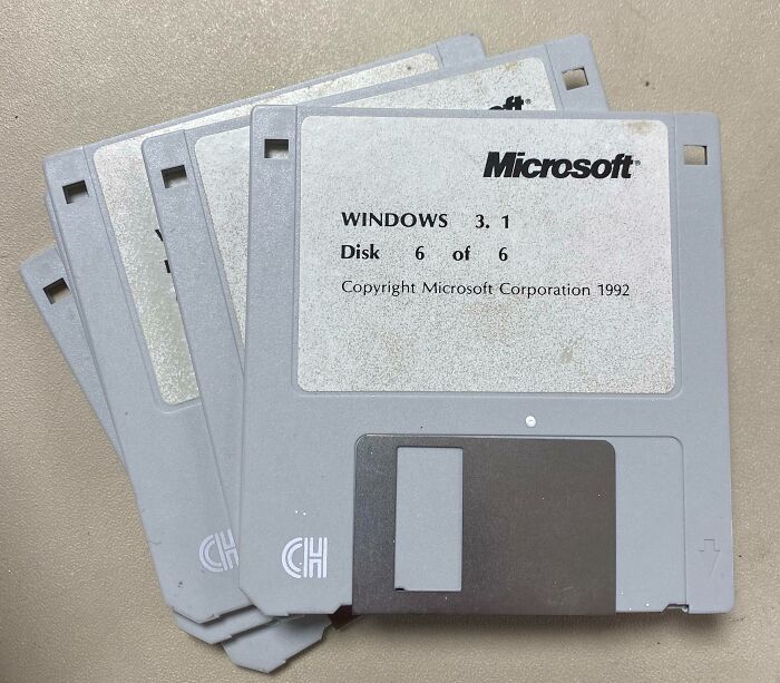 Set of vintage Windows 3.1 floppy disks showing retro technology and classic computing devices from the past era.
