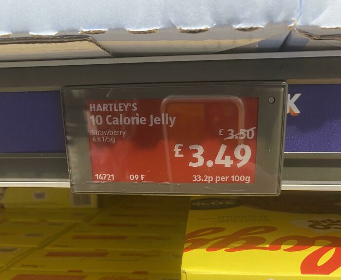 Electronic price tag showing Hartley's 10 Calorie Jelly strawberry flavor priced at £3.49 in a British grocery store shelf.