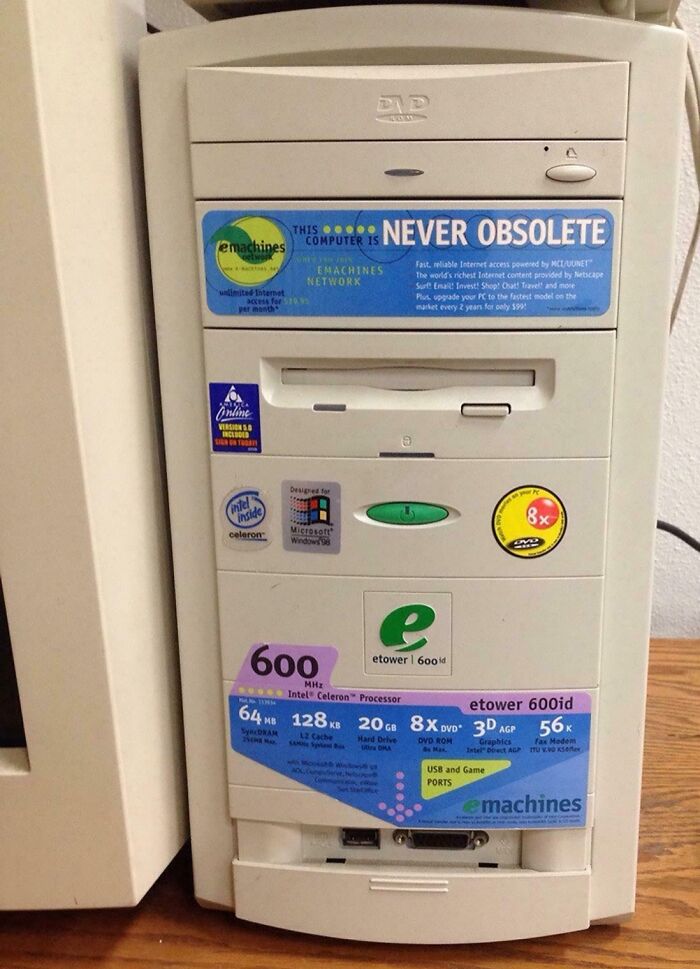 Vintage devices showing early computer tower with Celeron processor and DVD drive from emachines brand.