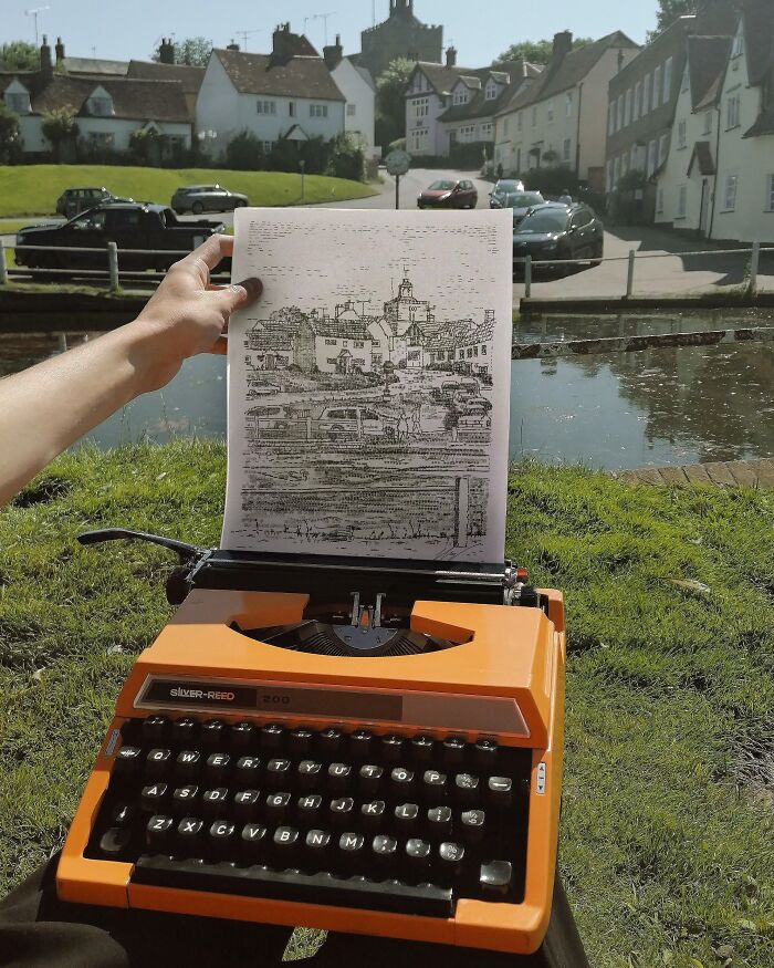 Vintage typewriter outdoors with hand holding paper showing a detailed image, illustrating vintage devices and technology evolution.