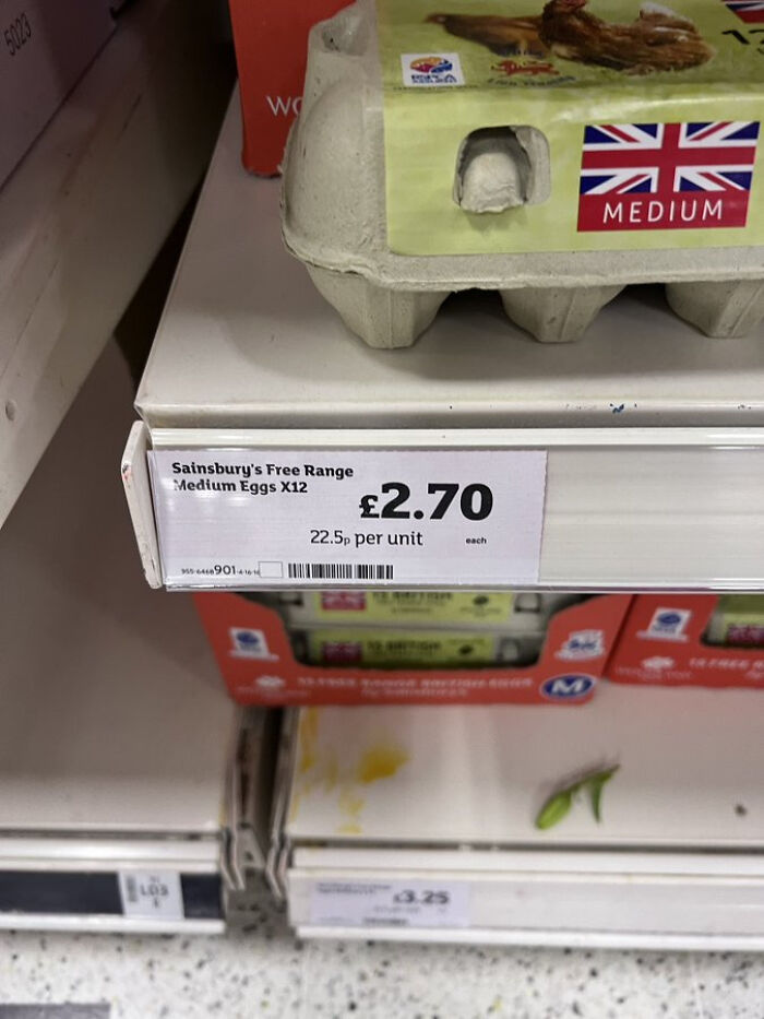 Sainsbury's free range medium eggs priced at £2.70 per dozen on store shelf in the U.K. grocery aisle.