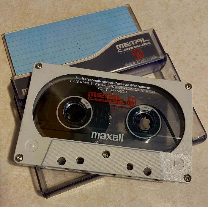 Vintage Maxell metal cassette tape and case, classic technology device illustrating vintage devices and tech evolution.