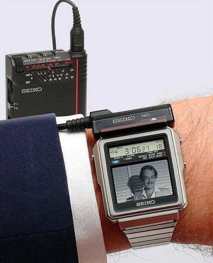 Vintage Seiko wristwatch with TV screen connected to portable black device, illustrating early vintage technology innovation.