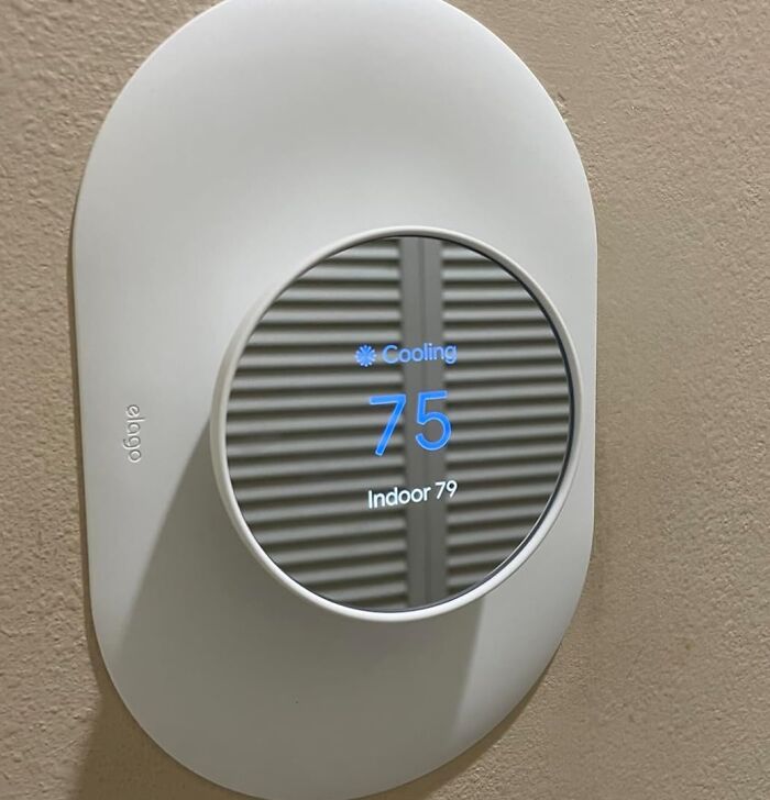 Smart thermostat on wall displaying cooling at 75 degrees, a top Amazon tech find for home gadget enthusiasts.