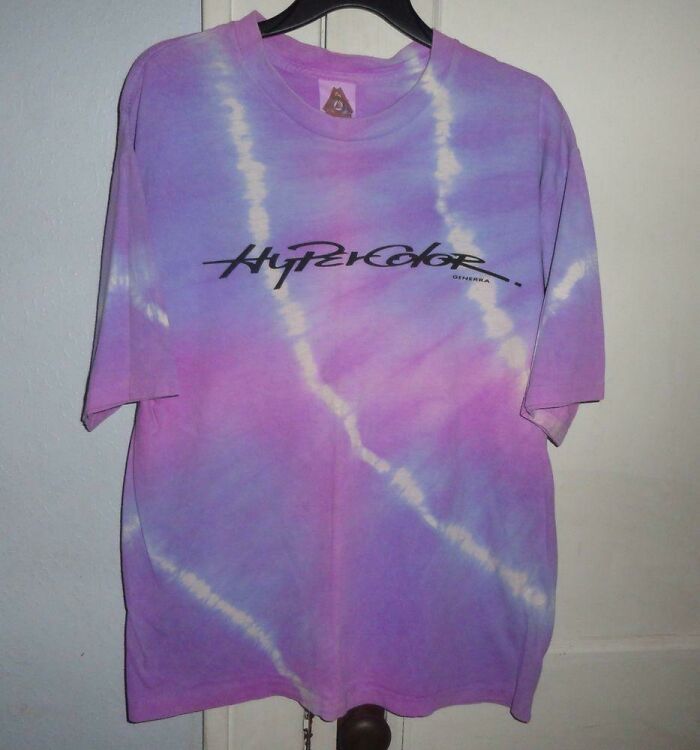 Tie-dye t-shirt with Hypercolor print, representing cringey nineties fashions left behind from the 90s era.