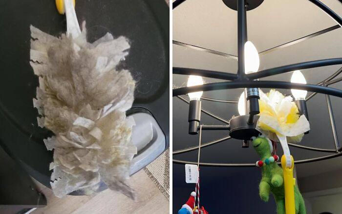 Dusty cleaning brush next to a trash can and a bright light fixture with hanging toys in a tidy room setting.