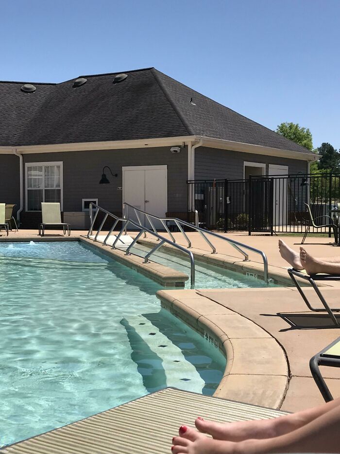 Pool area with cleverly designed handrails and ramps offering accessible solutions to overlooked issues in outdoor spaces.