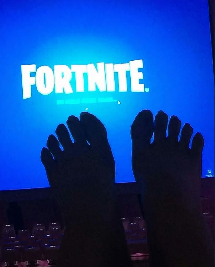 Feet in front of a blue Fortnite game screen, showcasing a cringey picture shared on an Instagram account.