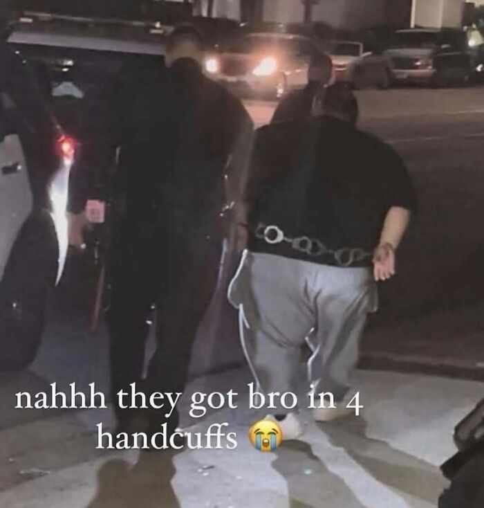 Person in four handcuffs being escorted at night, a cringey picture shared on Instagram account.