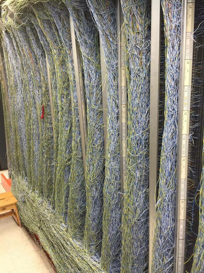 Messy tangled wiring panel showing a tech fail that will make you feel better about your computer skills.