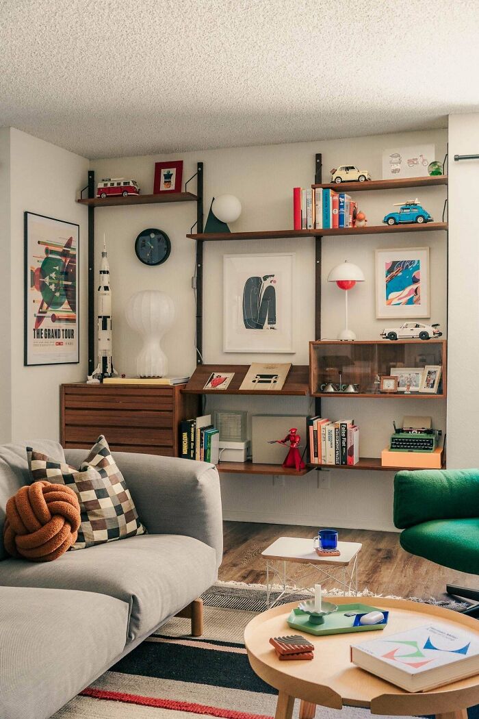 Mid-century designs in a cozy living room featuring vintage shelves, retro decor, and stylish modern furniture.