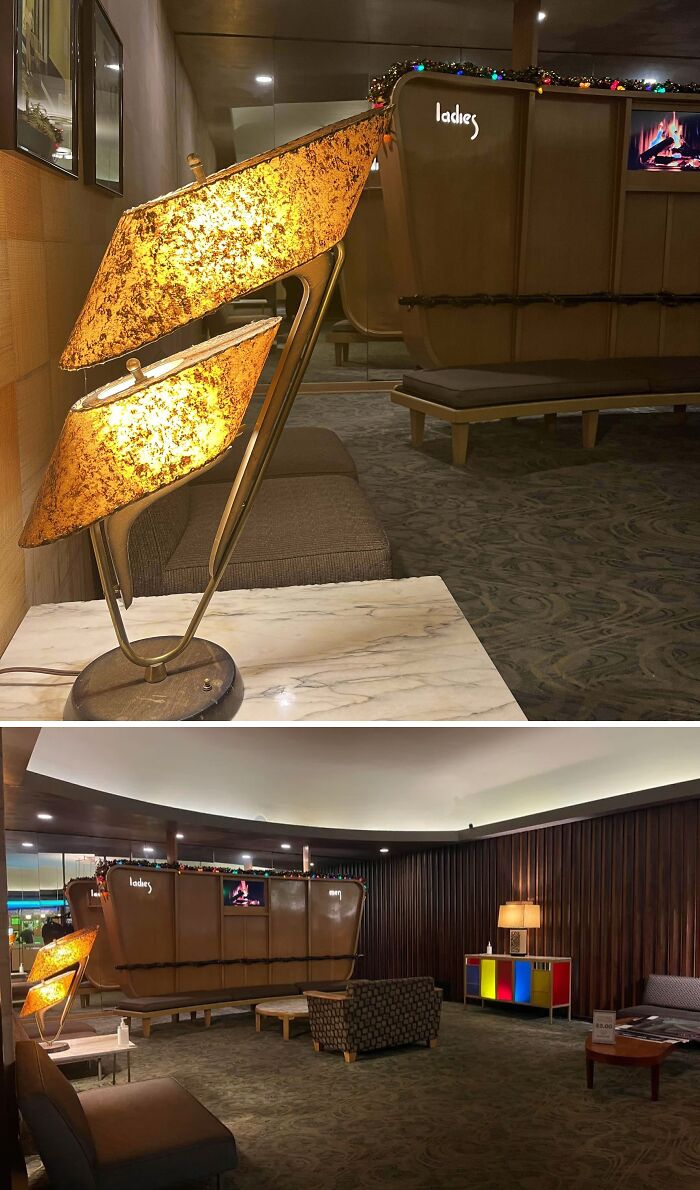 Mid-century designs featuring a vintage lamp and cozy lounge area with retro wood paneling and colorful cabinet.