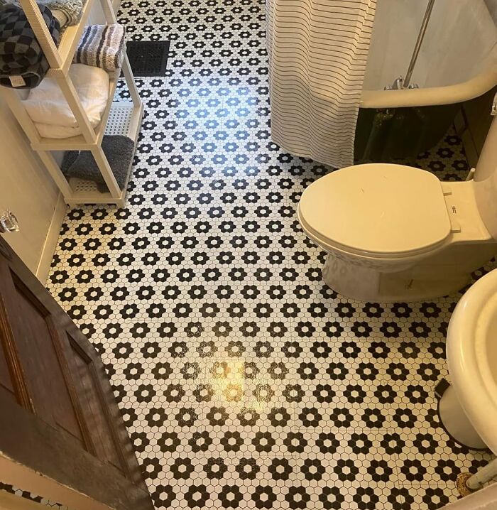 Bathroom floor with black and white flower-patterned tiles showcasing a quick weekend home upgrade style.