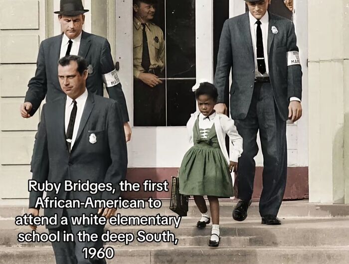 Ruby Bridges escorted by marshals attending a white elementary school, a monumental life moment frozen in time from history.