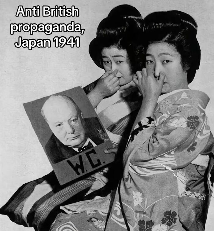 Two Japanese women in traditional dress holding anti British propaganda photo of Winston Churchill, historical monumental life moment frozen in time.