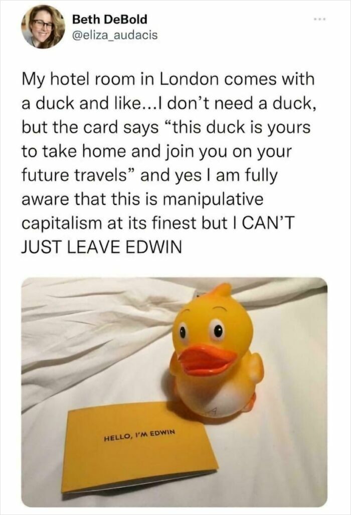 Rubber duck with a note named Edwin on a hotel bed, highlighting funny British memes about quirky UK travel experiences.