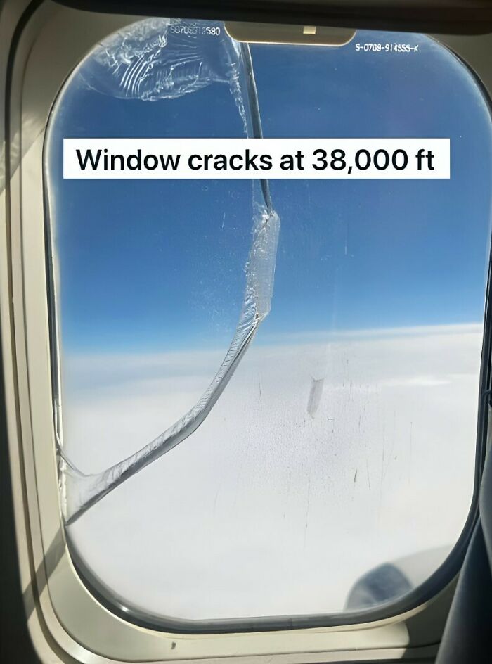 Airplane window with a large crack at 38,000 feet illustrating an unexpected fail in the anything gone wrong group.