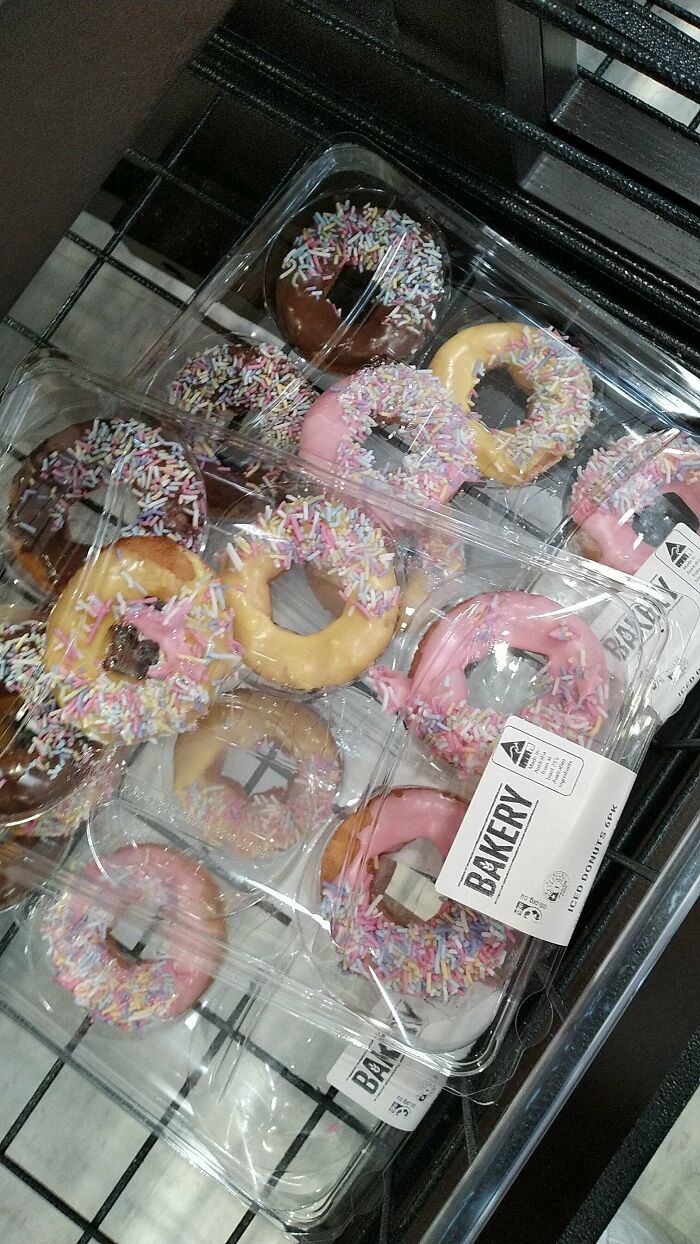 Clear plastic packs of small iced donuts with colorful sprinkles, illustrating products getting smaller and more expensive.