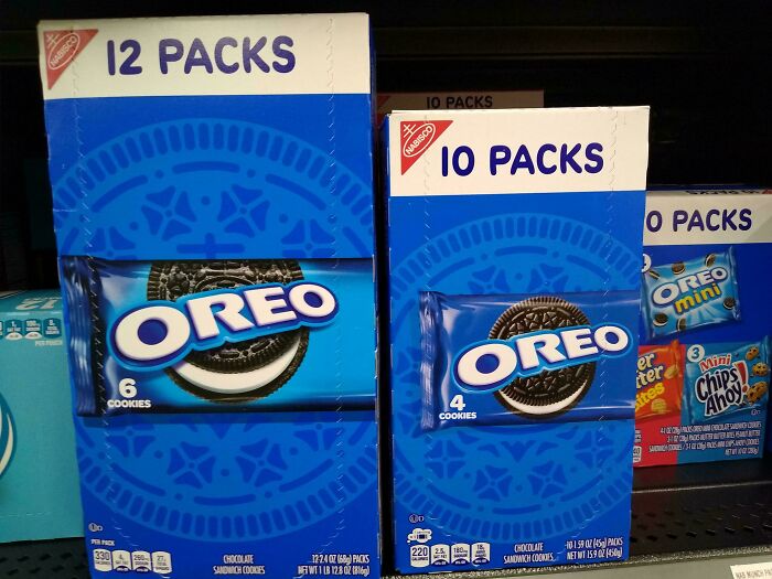Boxes of Oreo cookies showing smaller product sizes on store shelves, illustrating products getting smaller and more expensive.