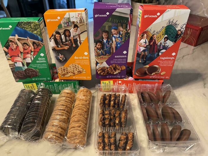 Boxes and smaller packages of Girl Scouts cookies showing products getting smaller and more expensive.