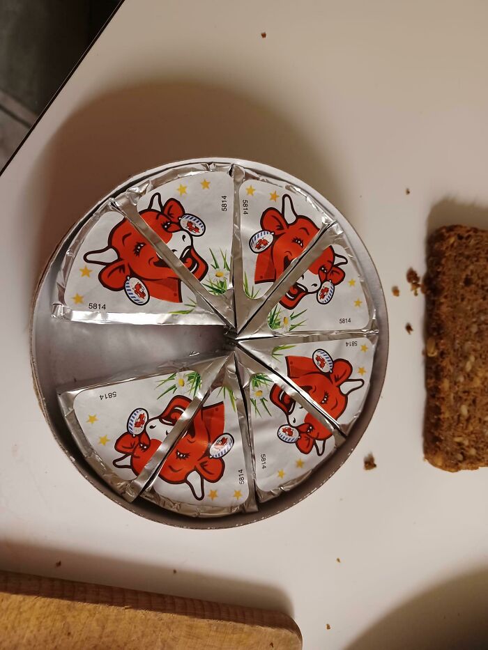 Small cheese wedges in a round container illustrating how products are getting smaller and more expensive over time.