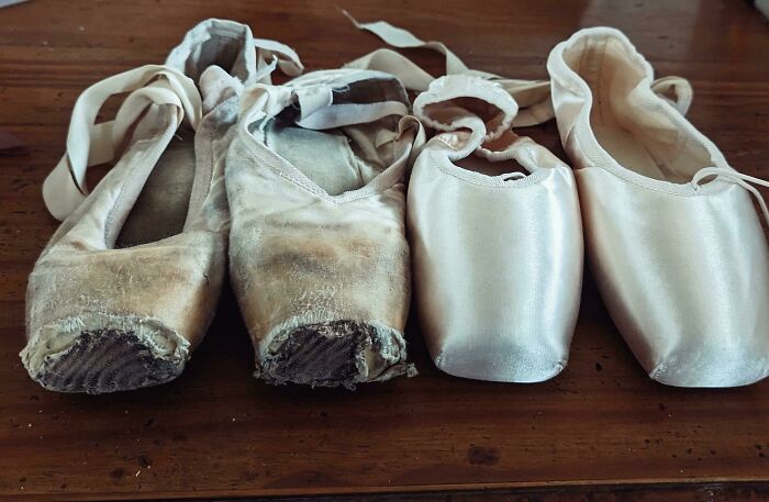 Worn and new ballet pointe shoes side by side showing dramatic before and after photos of usage and wear.