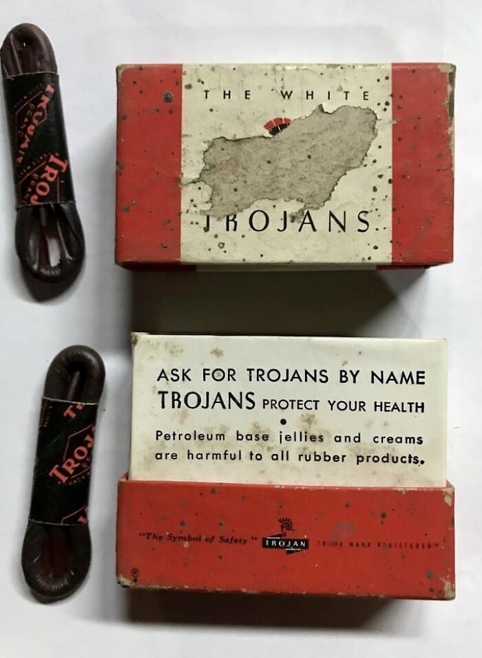 Vintage Trojan c****m packaging and wrapped condoms, showing how things used to look in the past.