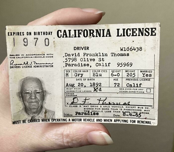 Vintage California driver license from 1965 showing old photo ID, personal details, and handwritten signatures portraying how things used to look.