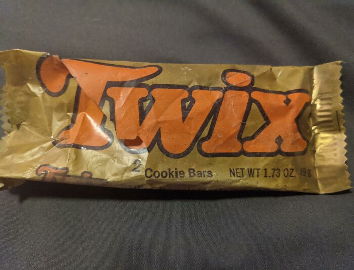 Vintage Twix candy bar in old gold wrapper, showcasing how things used to look with classic packaging design.