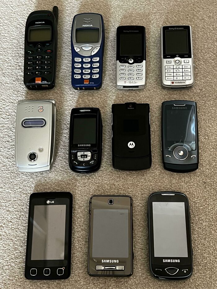 A collection of old mobile phones from various brands, showing how things used to look in early cell phone design.