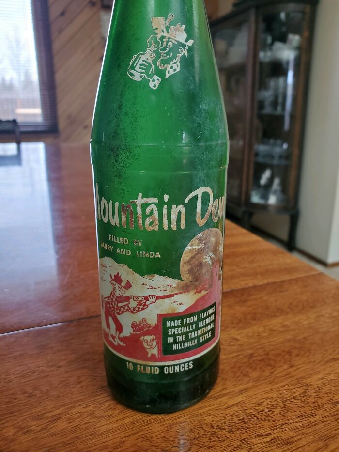 Vintage Mountain Dew glass bottle with original label, showcasing how things used to look in classic soda packaging.