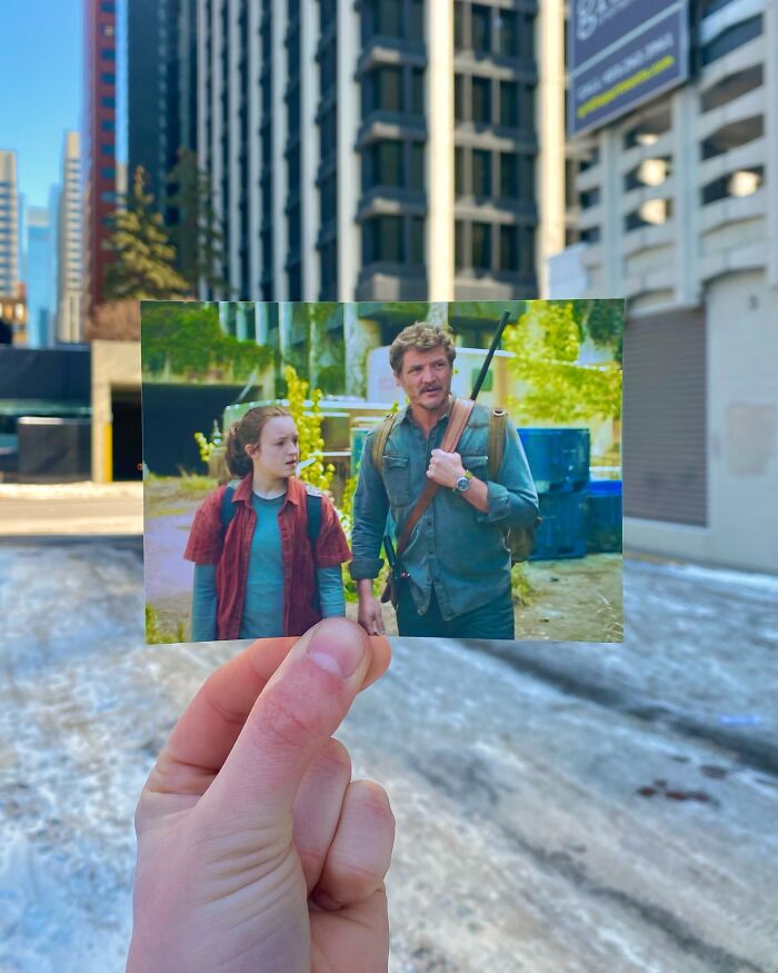 Hand holding photo of real-life filming location from movie and TV show scene against urban city background.