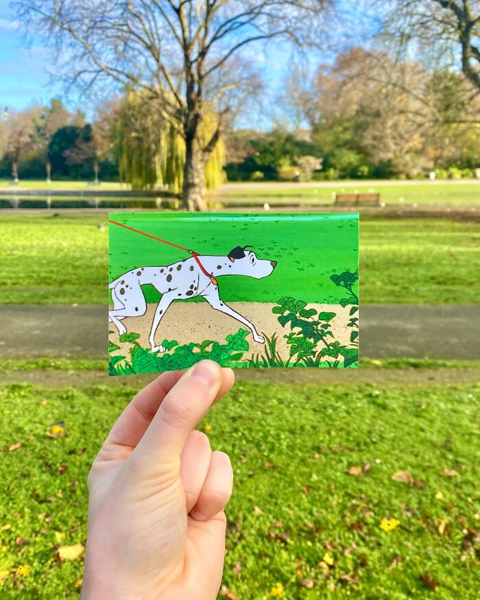 Hand holding a scene from a movie showing a dog on a leash, matched with its real-life filming location outdoors in a park.