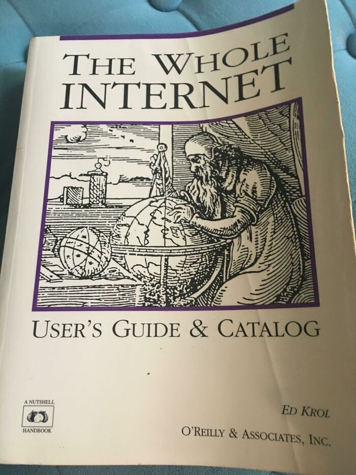 Book titled The Whole Internet User's Guide and Catalog with an old-style drawing on the cover showing a scholar examining globes.