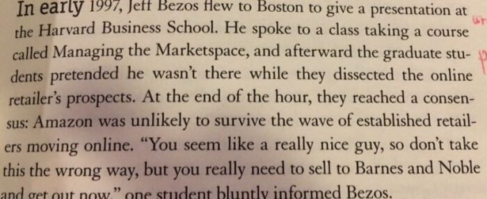 Close-up of a book page discussing Jeff Bezos and early doubts about Amazon’s survival during the rise of online retail.