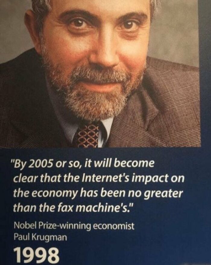 Nobel Prize-winning economist Paul Krugman in 1998 with a facepalm-worthy screenshot of a wrong internet prediction.