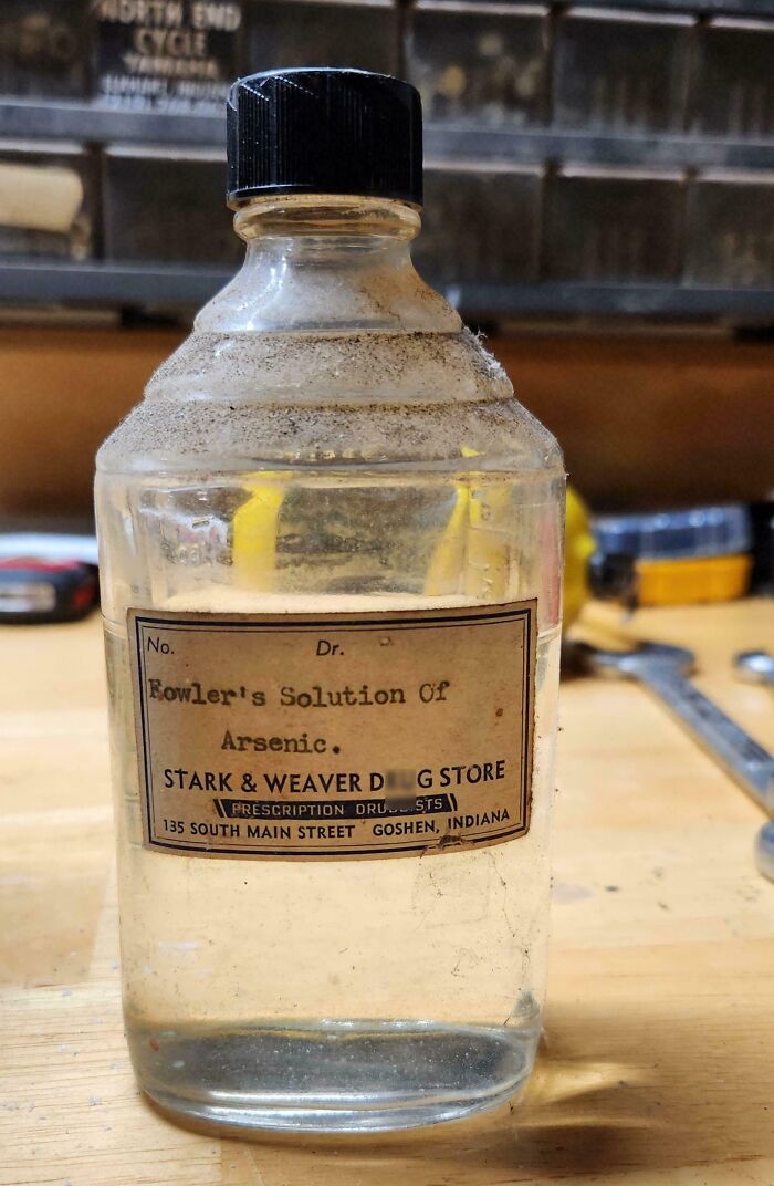 Old glass bottle labeled Fowler’s Solution of Arsenic found among bizarre things in old houses.