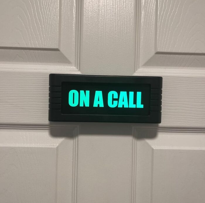 Lighted sign on office door displaying on a call, adding personality to the workspace with funny finds.