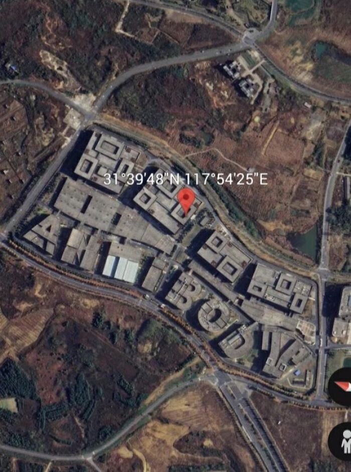 Aerial view of buildings spelling out "ANTIBODY" captured on Google Earth showing odd and unexpected sights.