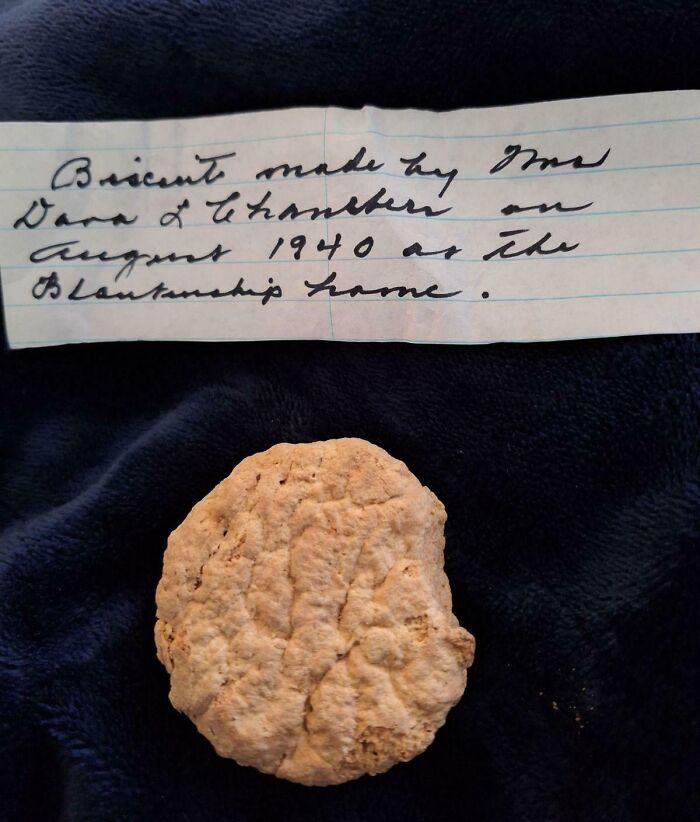 A handwritten note and a preserved biscuit found in an old house, labeled First Prize String Beans.