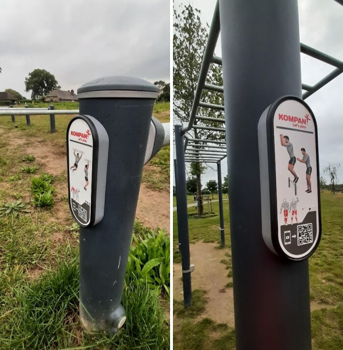 Outdoor exercise station with dangerous designs and death traps, showing instructional signs on metal poles in a park setting.