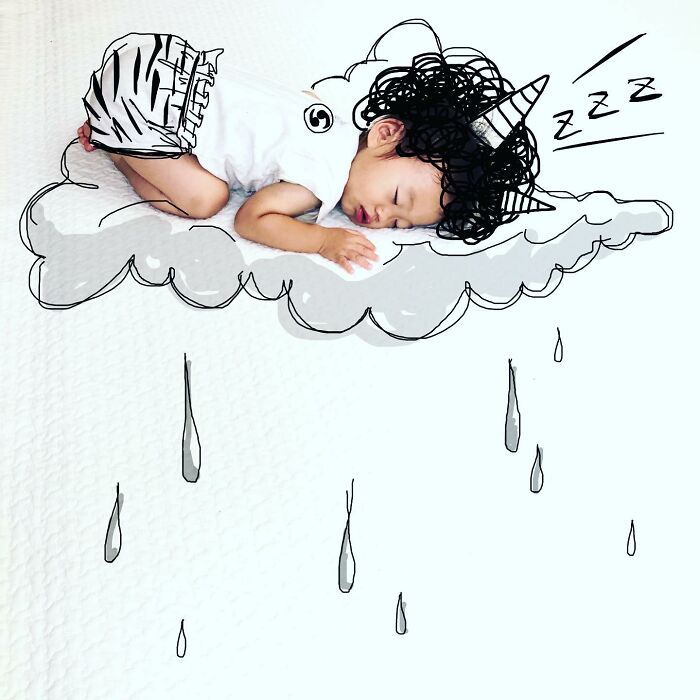 Sleeping toddler with hand-drawn unicorn horn, cloud, and rain illustrations by Japanese father on kids’ photos.