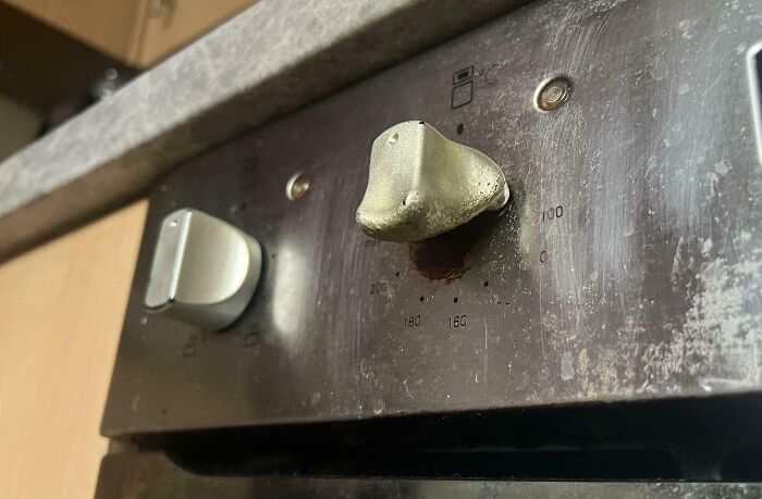 Close-up of a rusted and damaged stove control k**b illustrating one of the dangerous designs that could be classified as death traps.