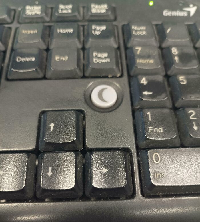 Close-up of a keyboard showing a dangerous design with arrow keys misaligned, an example of death trap designs.